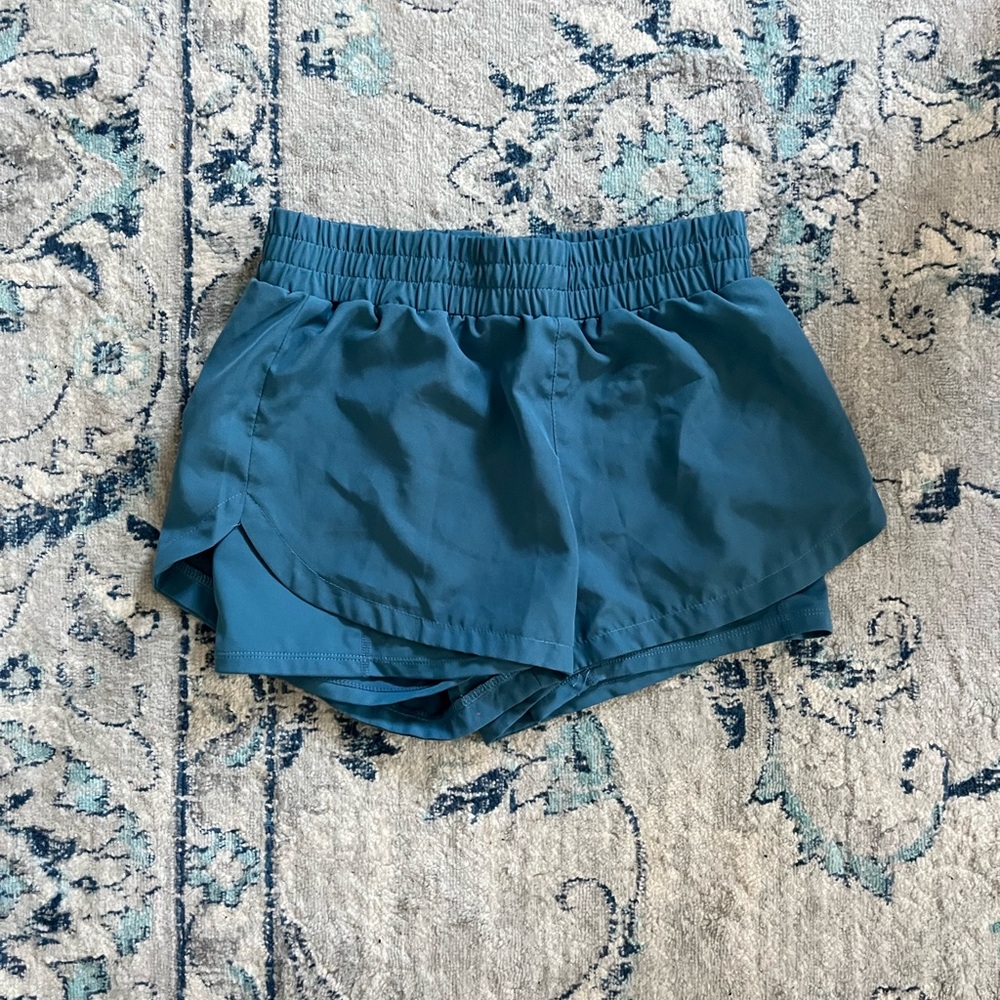 Blue athletic shorts.